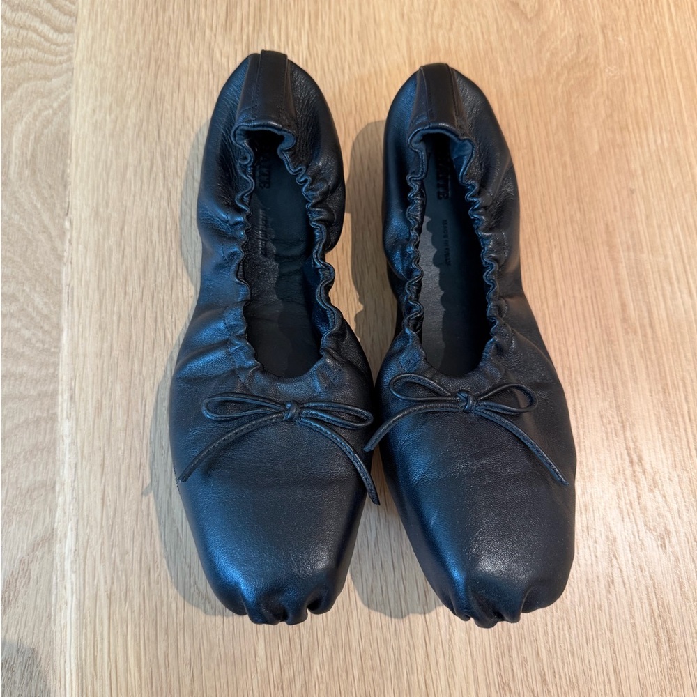 KHAITE Ashland Black Leather Flats with Bow Accent
